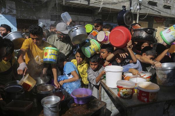 Palestinians crowded together as they wait for food distribution in Rafah, southern Gaza Strip, on Wednesday. (Picture: AP Photo/Hatem Ali, File) Palestinians crowded together as they wait for food distribution in Rafah, southern Gaza Strip, on Wednesday. (Picture: AP Photo/Hatem Ali, File)